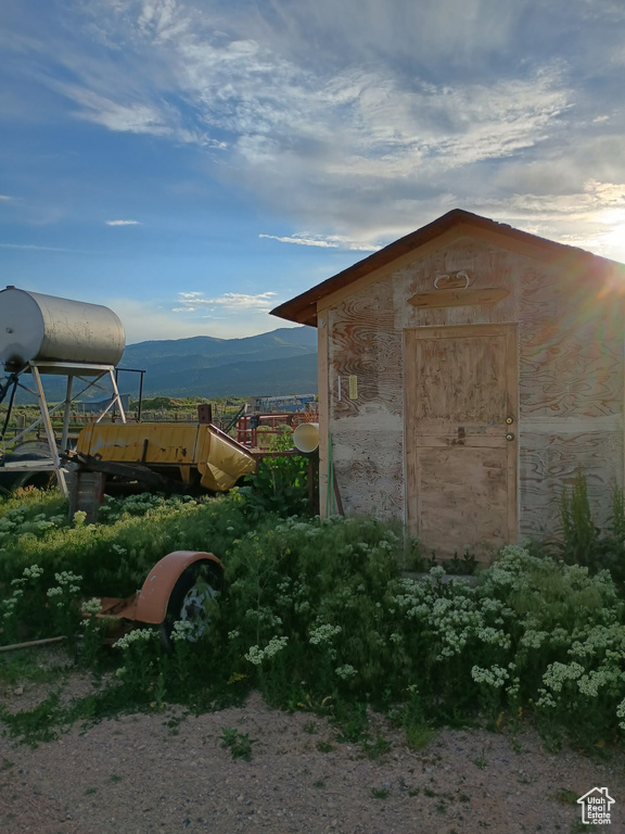 View of outbuilding with a mountain view