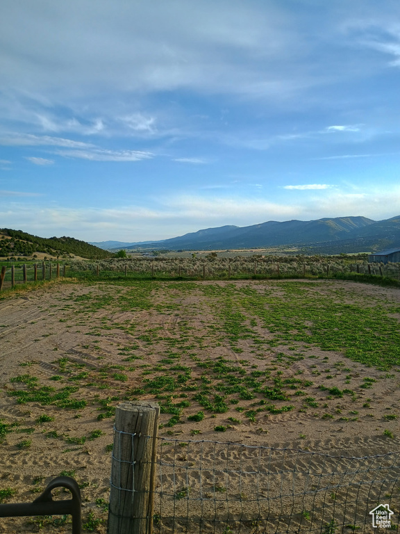 View of mountain background featuring rural landscape