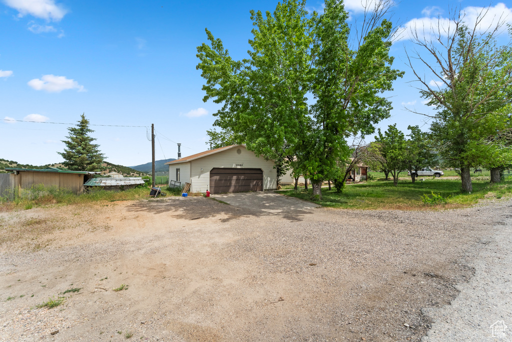 View of front of property featuring a garage