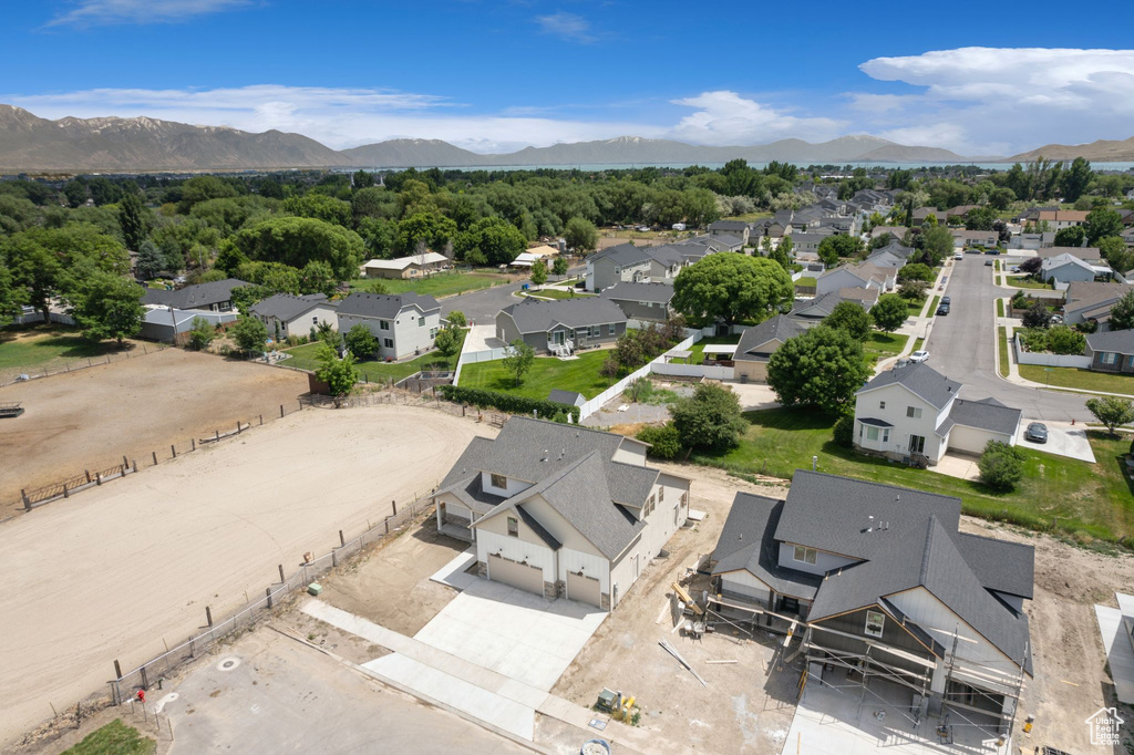 Aerial view of residential area featuring a mountain backdrop