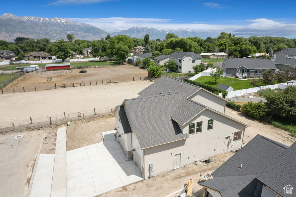 Aerial perspective of suburban area featuring a mountainous background