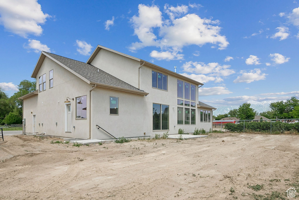 Back of house with stucco siding