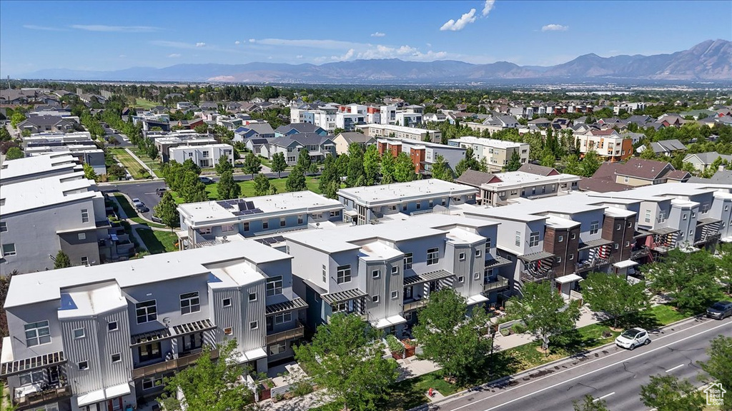 Aerial perspective of suburban area with a mountainous background