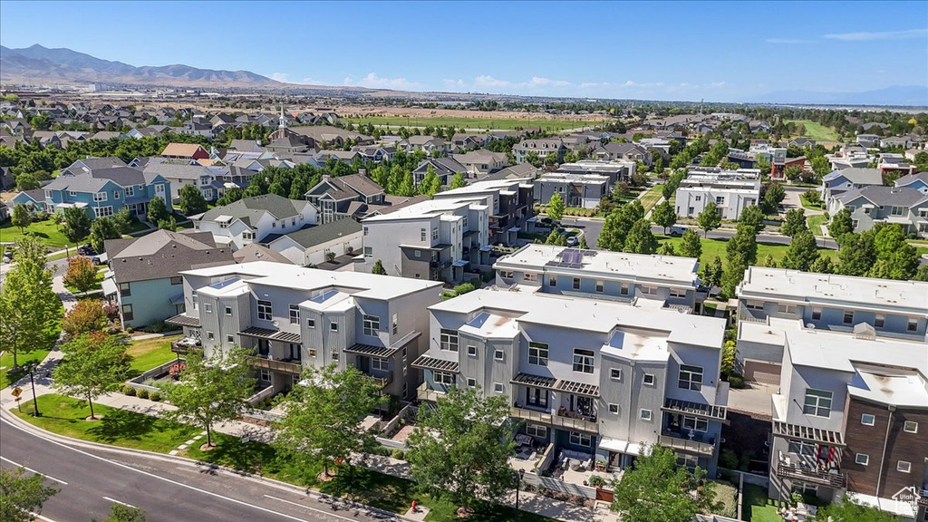 Aerial view of residential area featuring a mountainous background