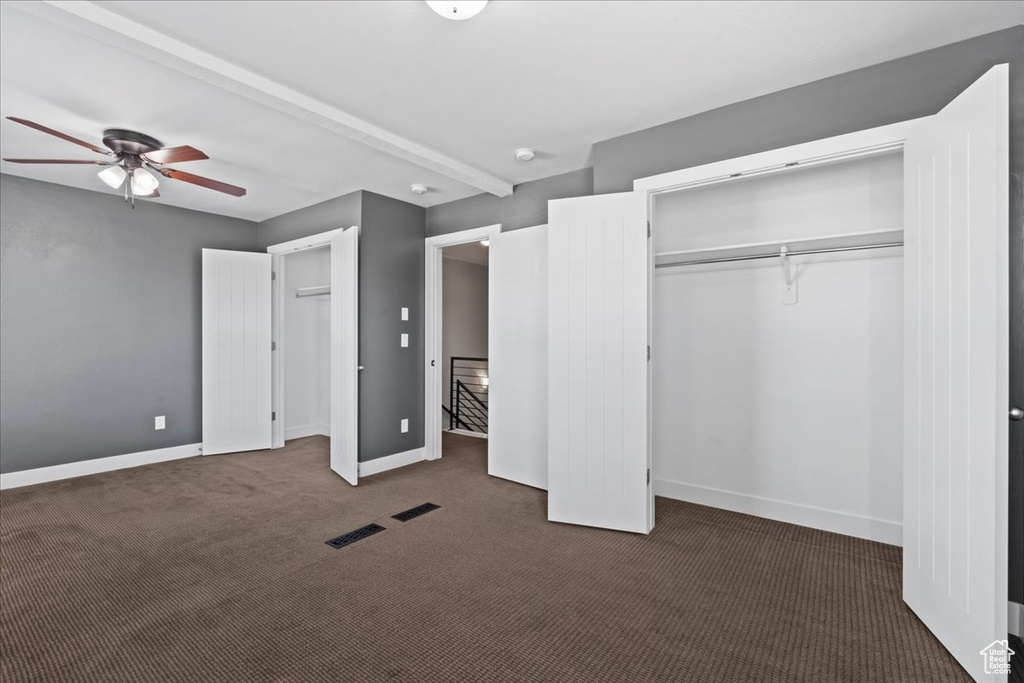Unfurnished bedroom featuring carpet floors and baseboards