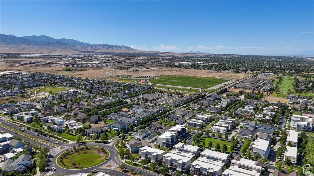 Aerial view of property\'s location with a mountain backdrop and nearby suburban area