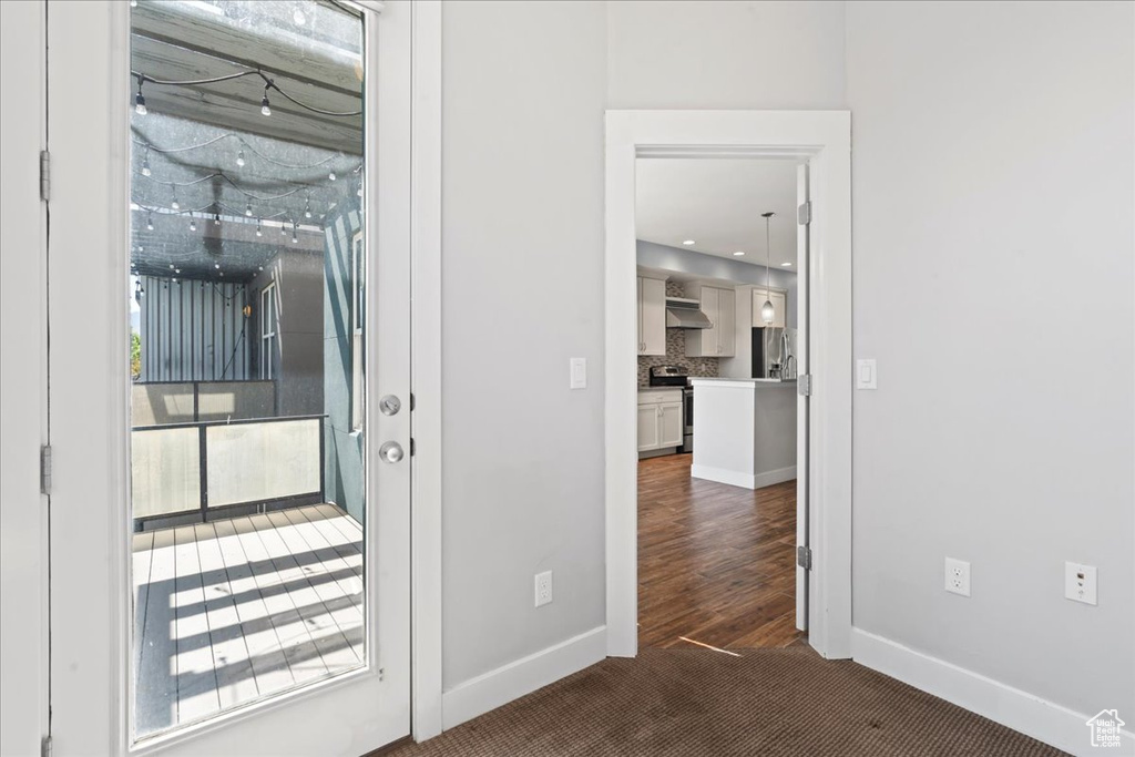 Unfurnished room featuring baseboards and carpet floors