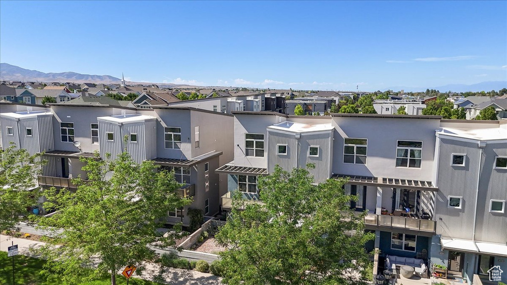 View of building exterior with a residential view and a mountain view