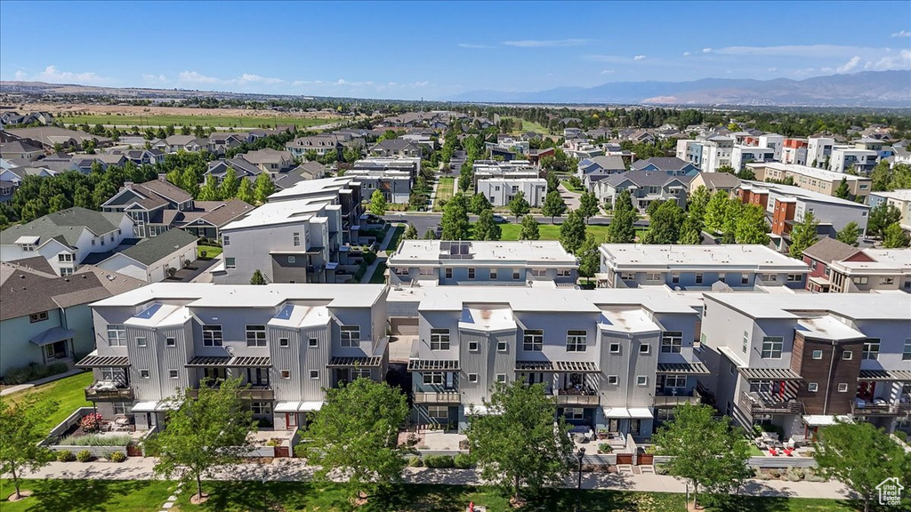 Aerial perspective of suburban area featuring a mountain backdrop