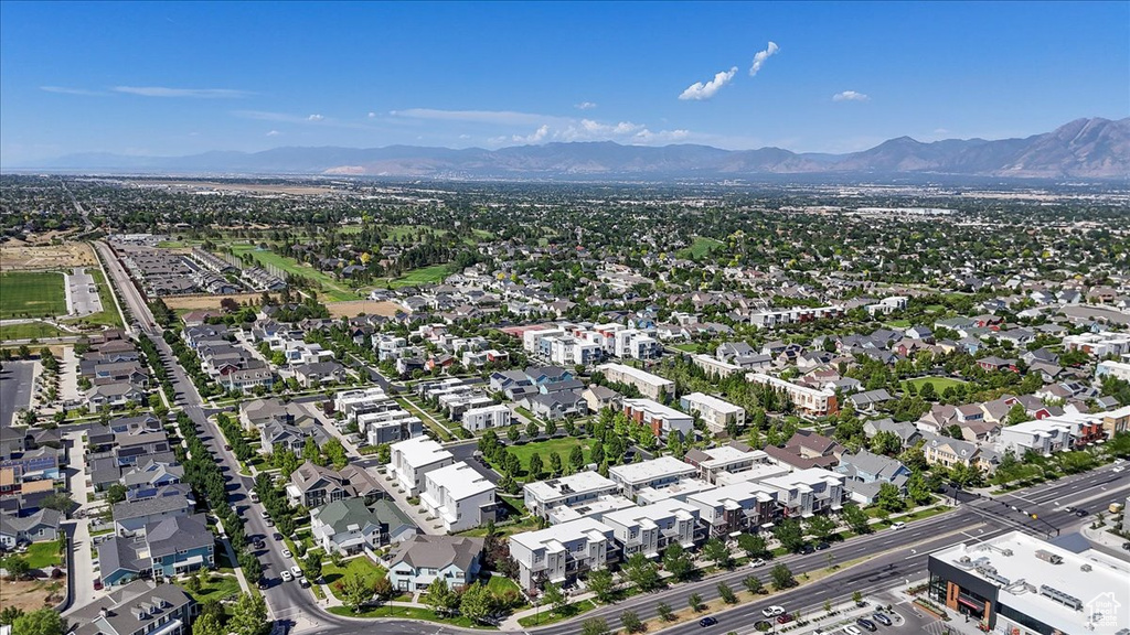 Aerial perspective of suburban area featuring a mountain backdrop