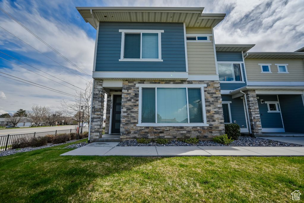 View of front of property with stone siding