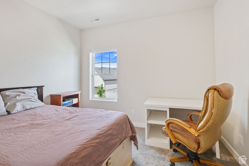 Bedroom with carpet and baseboards
