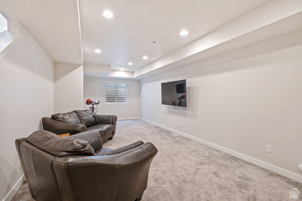 Sitting room featuring light carpet, baseboards, and recessed lighting