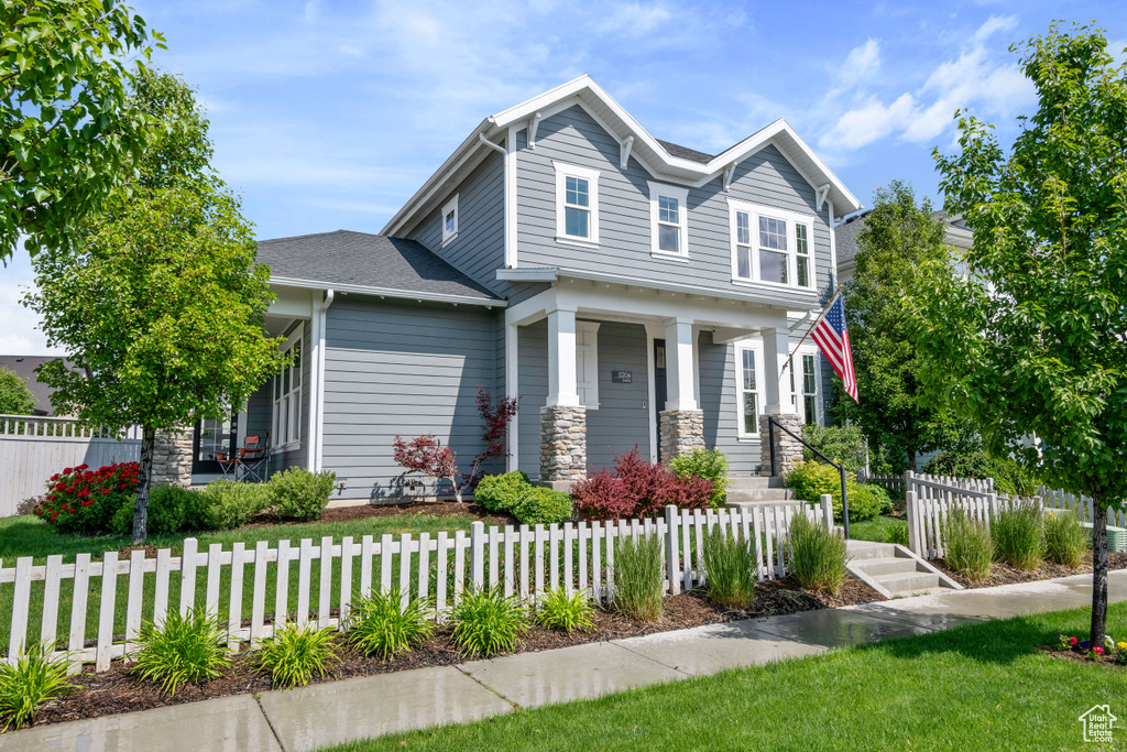 Craftsman-style home featuring covered porch