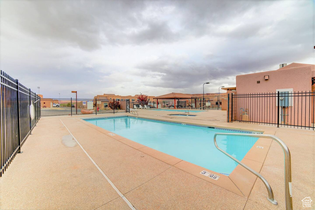 Community pool featuring a patio
