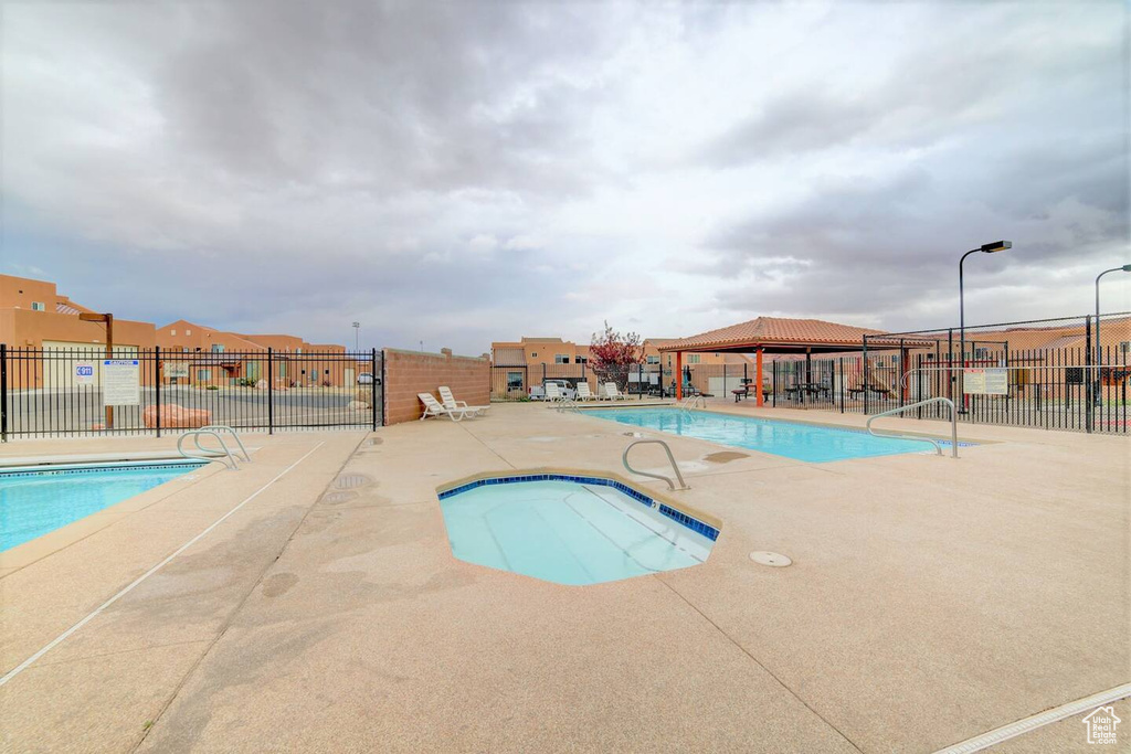 Community pool featuring a patio