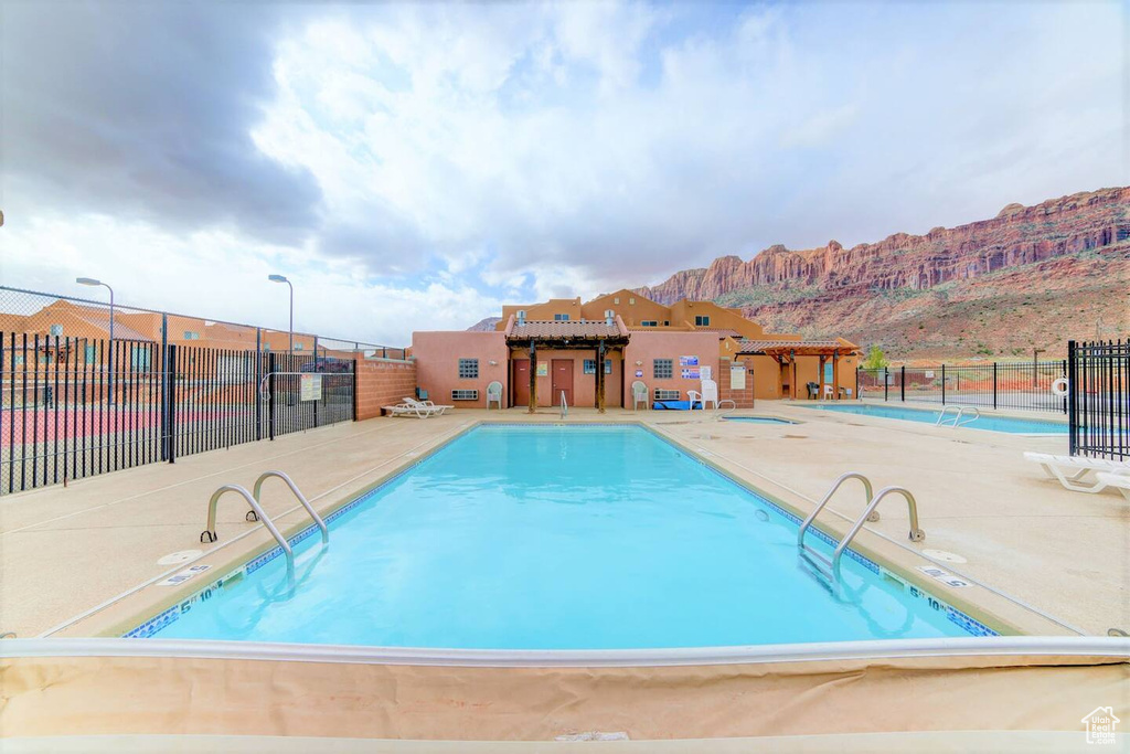 Community pool with a patio