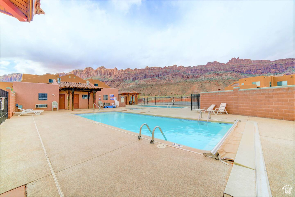 Community pool with a patio area
