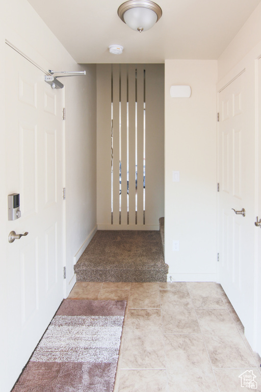 Hall with tile patterned floors