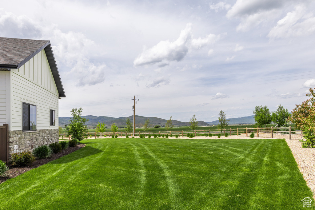 View of yard featuring a mountain view and a view of countryside