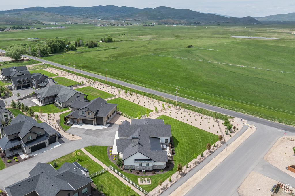 Aerial perspective of suburban area featuring a mountainous background