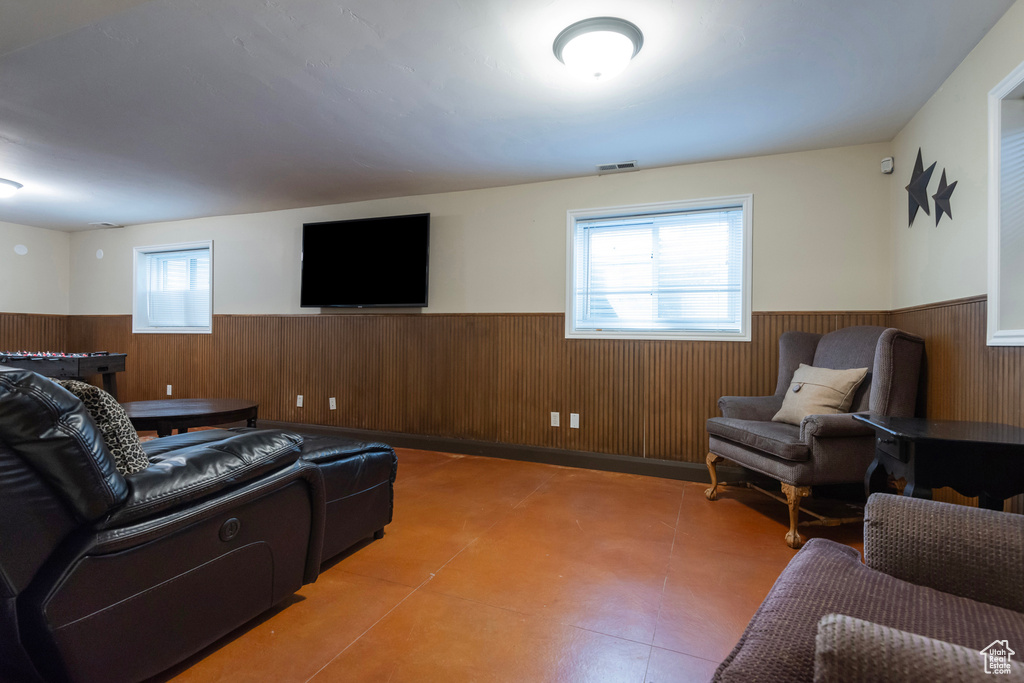 Living room with a wainscoted wall and wood walls