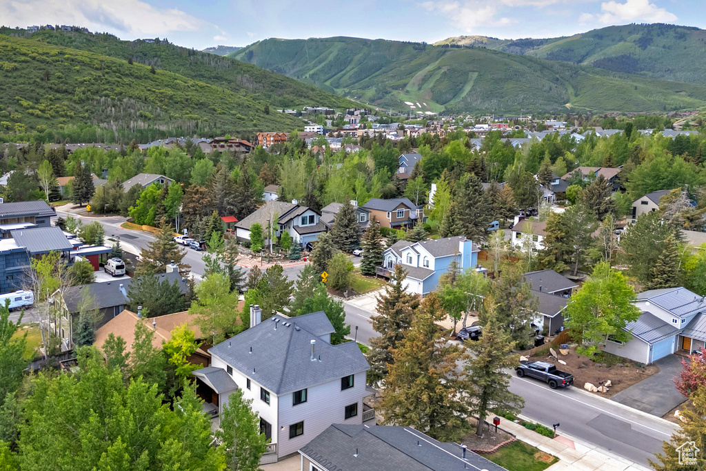 Aerial perspective of suburban area with a mountainous background