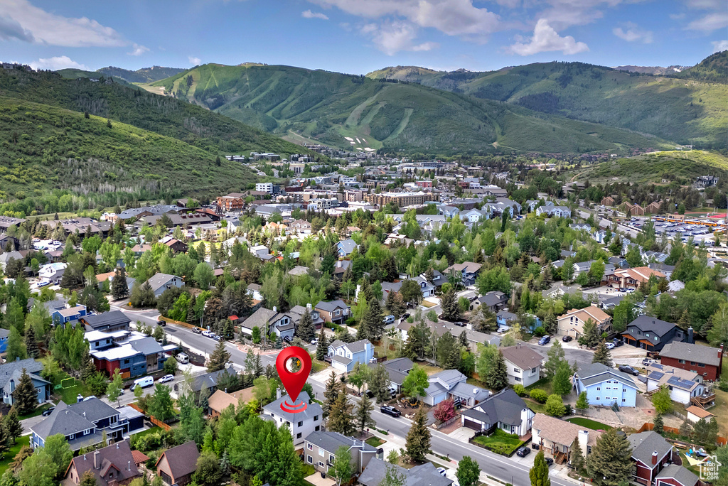 Aerial perspective of suburban area with a mountain backdrop