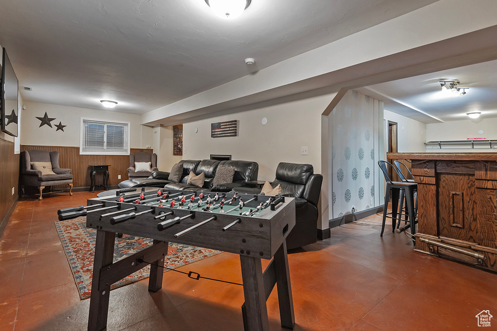 Rec room with wooden walls and wainscoting