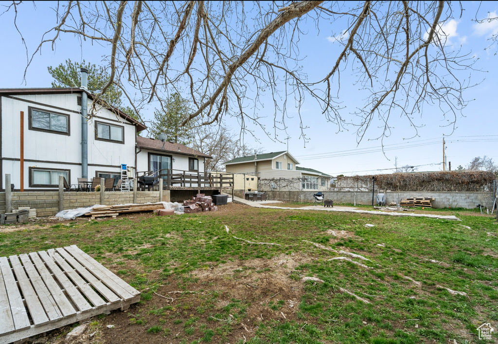 View of yard with a wooden deck