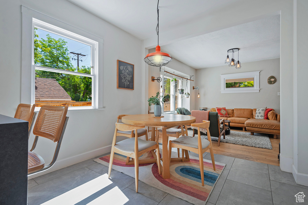 Dining room with baseboards and tile patterned floors