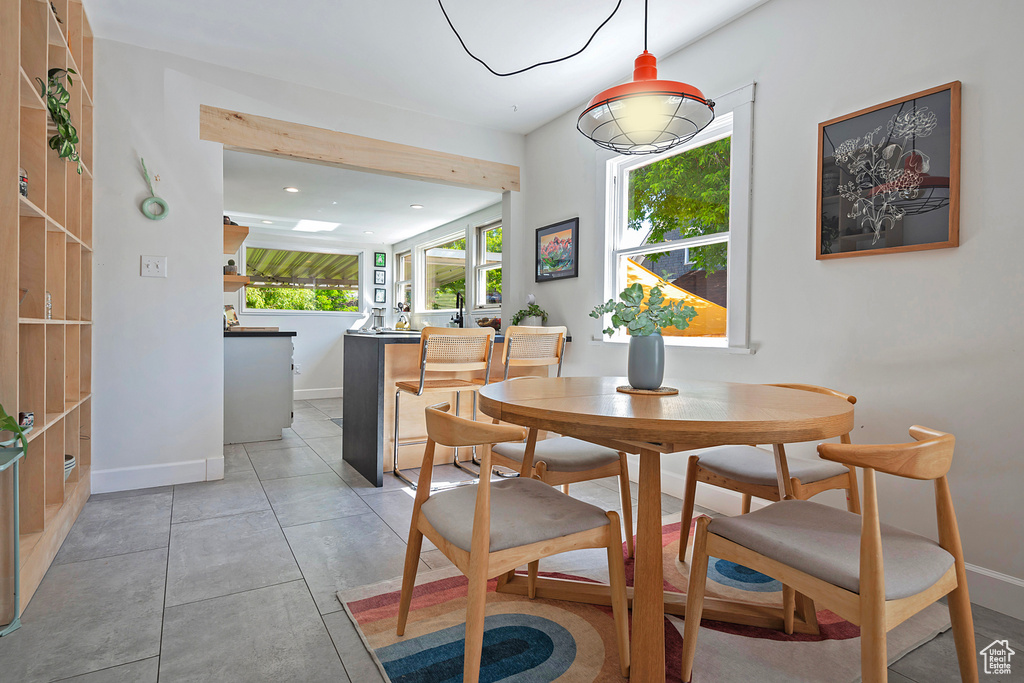 Dining room featuring baseboards and recessed lighting