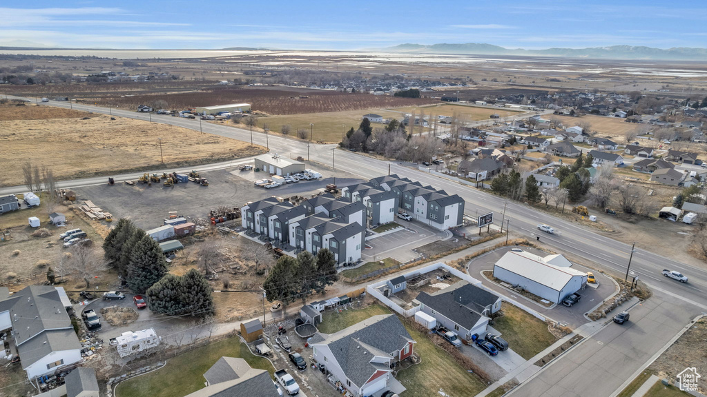 Aerial perspective of suburban area with a mountain backdrop