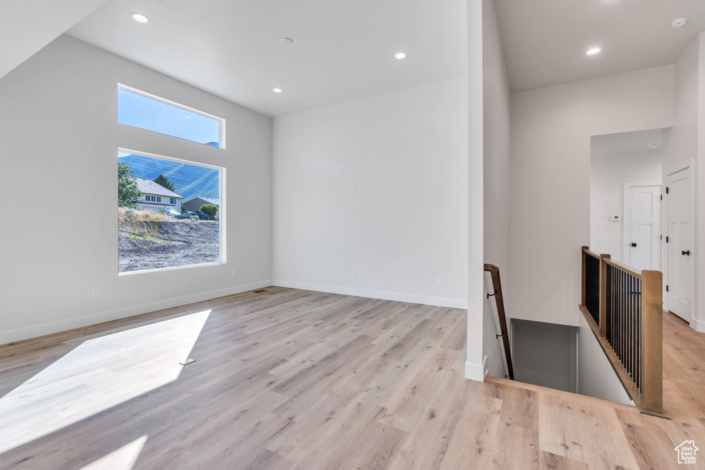 Interior space with recessed lighting and light wood-style floors