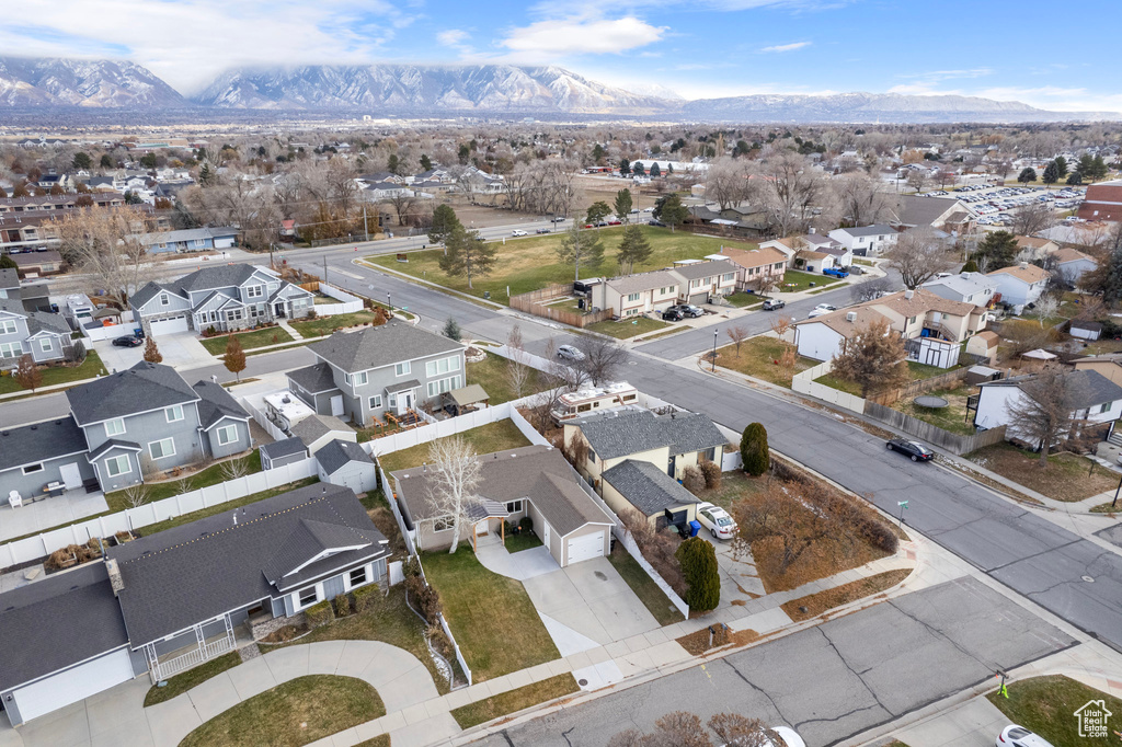 Aerial perspective of suburban area featuring a mountain backdrop