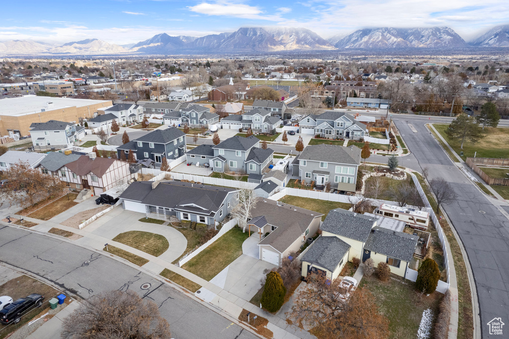 Aerial perspective of suburban area with a mountain backdrop