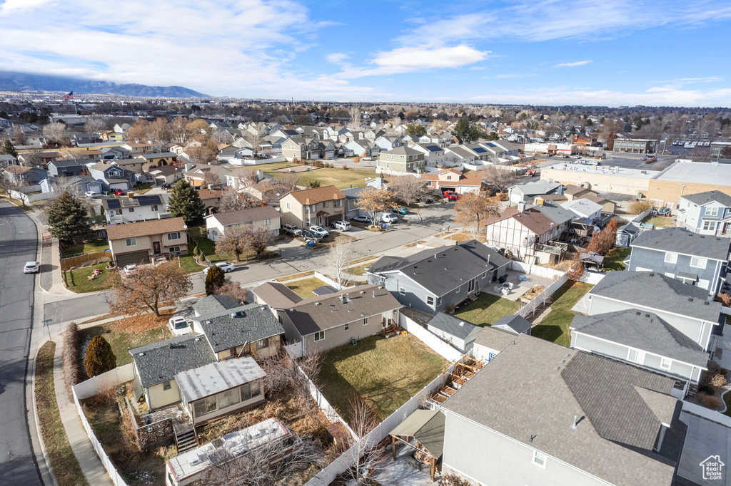 View of property location featuring nearby suburban area and a mountain backdrop