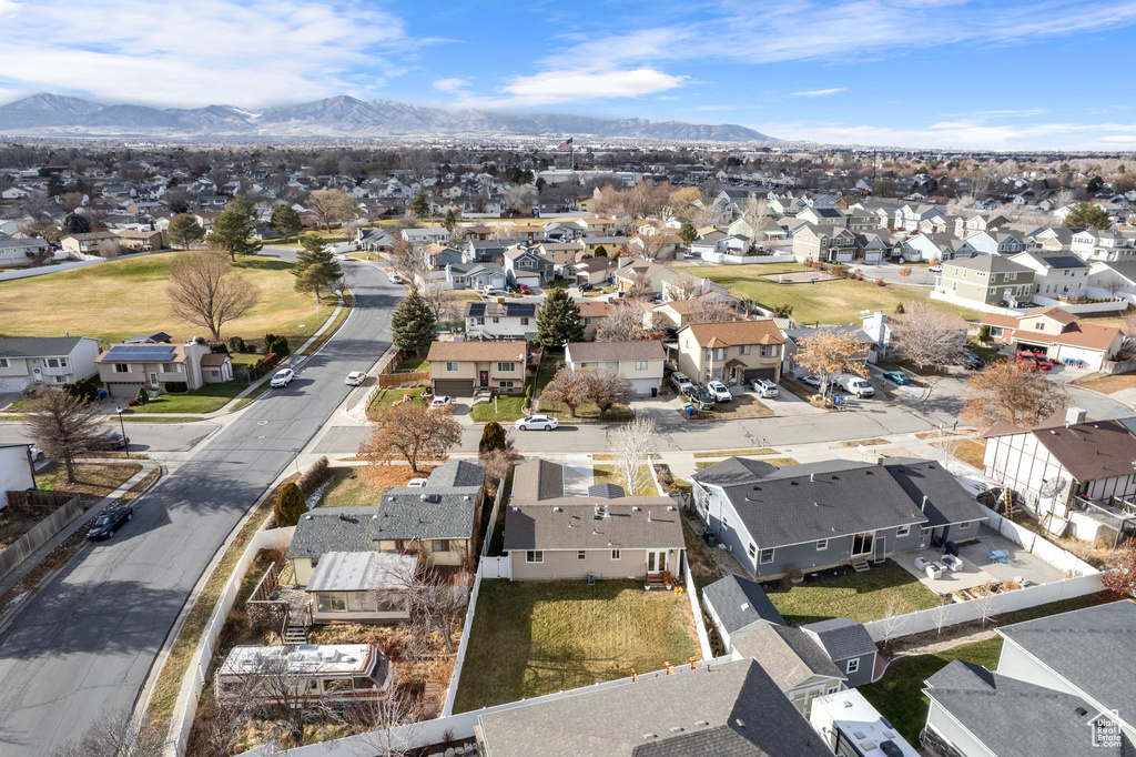 Aerial perspective of suburban area with a mountainous background