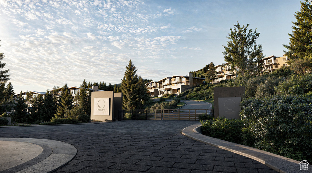 Surrounding community featuring a residential view and a gate