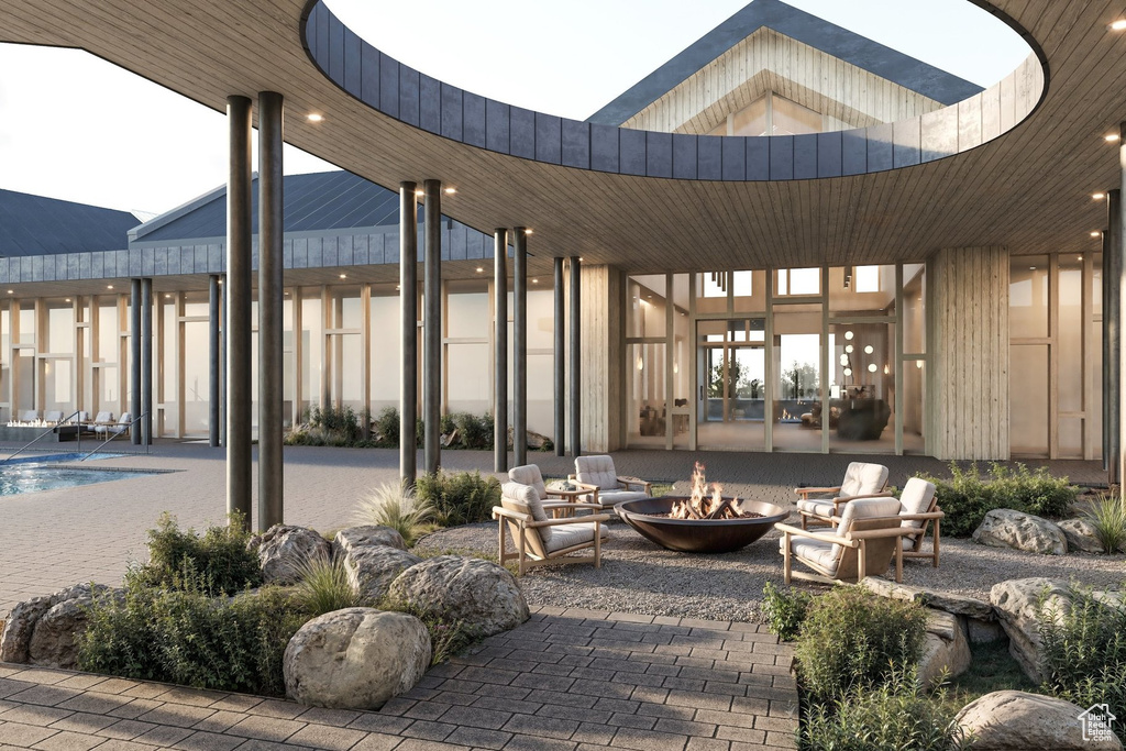View of patio / terrace featuring an outdoor fire pit