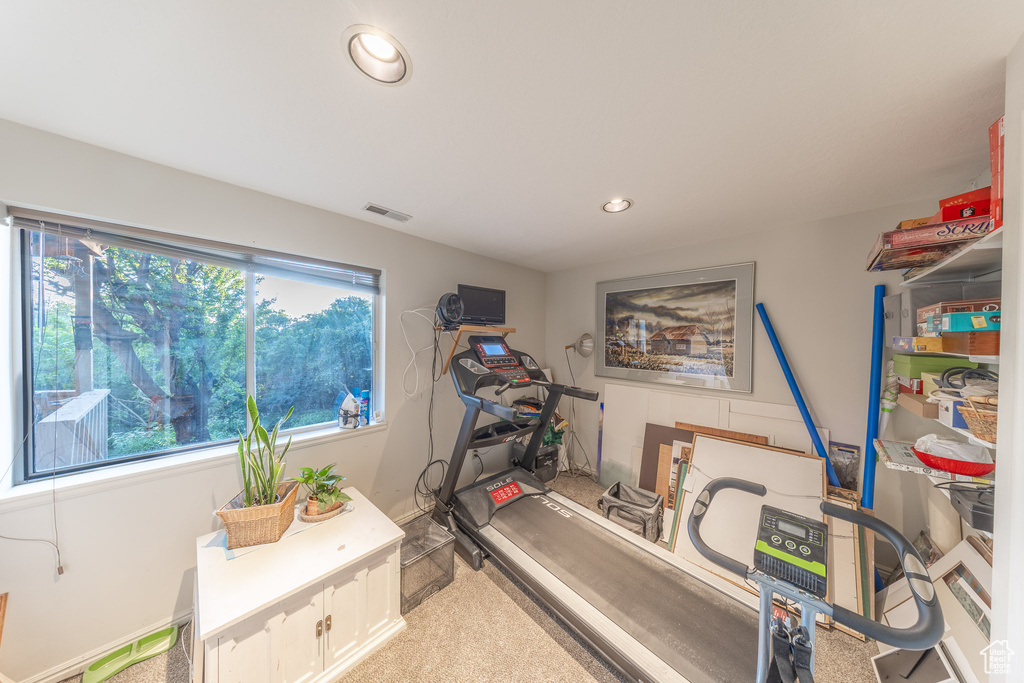 Exercise room featuring recessed lighting and carpet floors