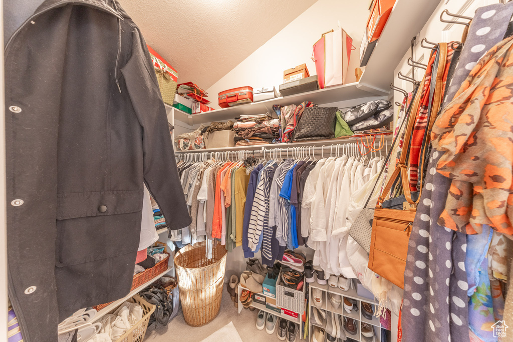 Spacious closet featuring lofted ceiling