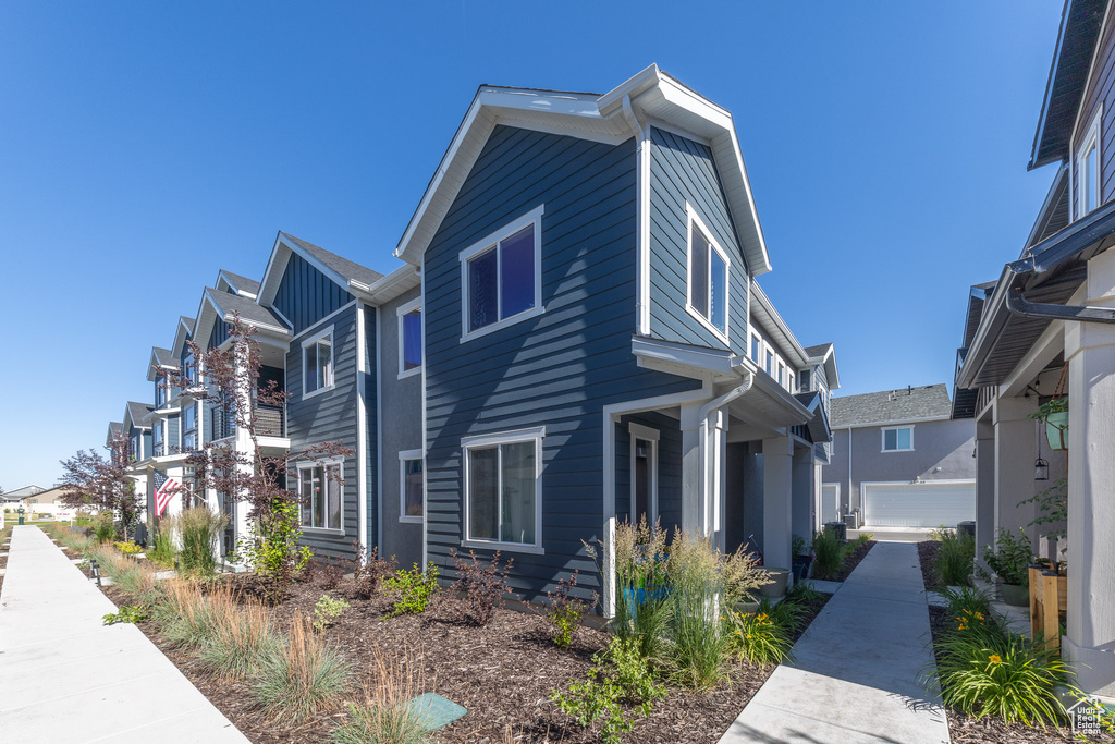 View of side of property with a residential view