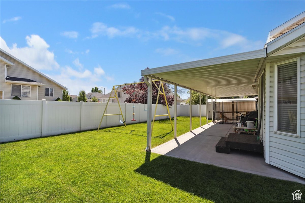 View of yard with a patio