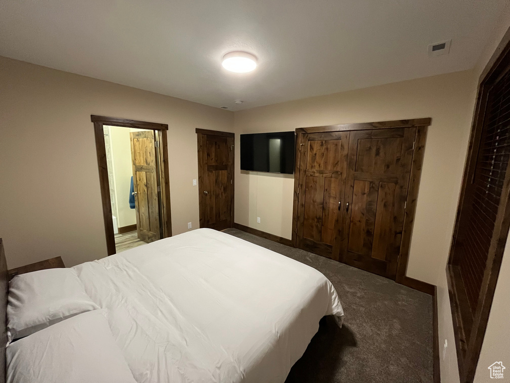 Carpeted bedroom with baseboards