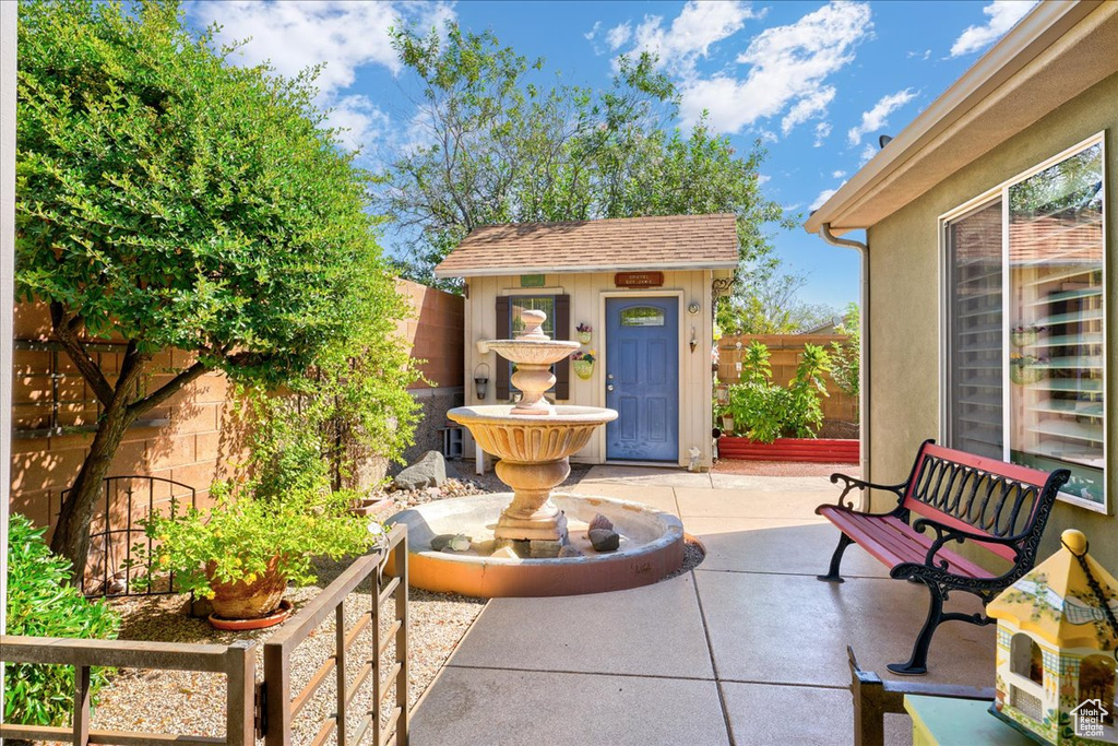 Fenced backyard with a patio area