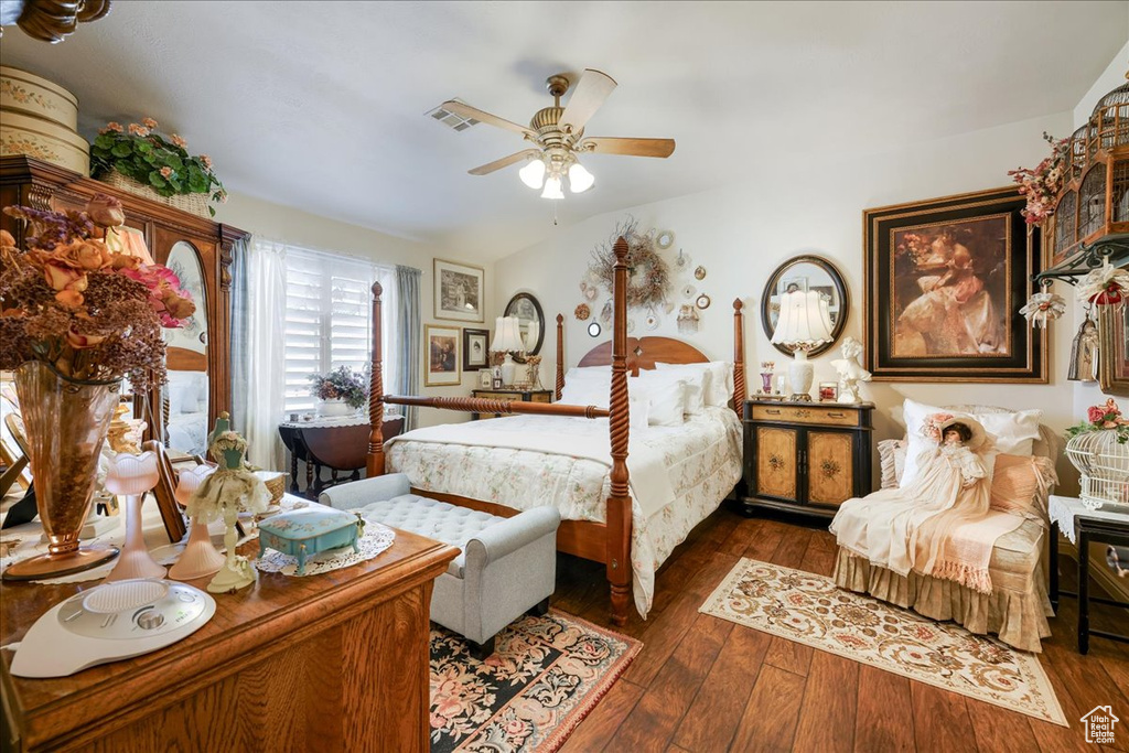 Bedroom featuring wood-type flooring and ceiling fan