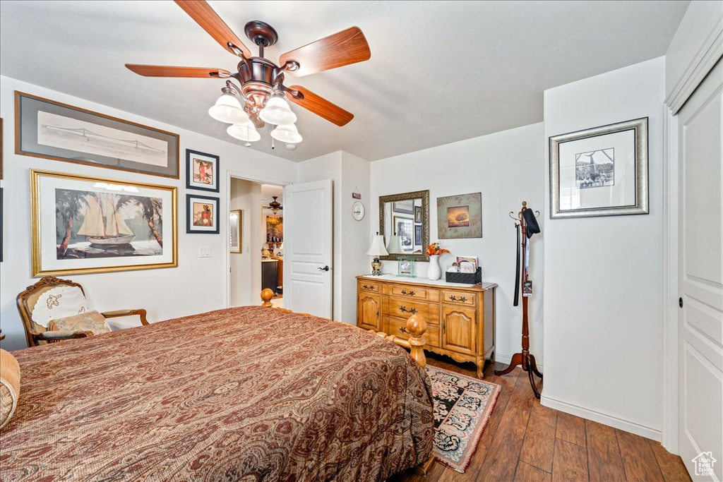 Bedroom featuring dark wood finished floors and ceiling fan