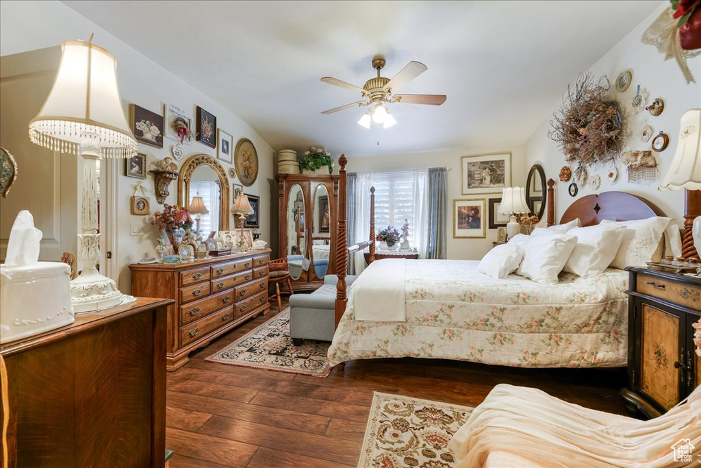 Bedroom with dark wood finished floors and ceiling fan