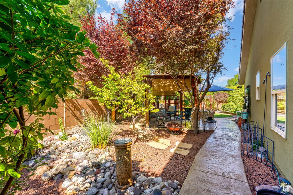 Fenced backyard featuring a patio area